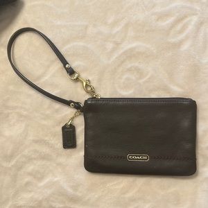 Brown coach wristlet.